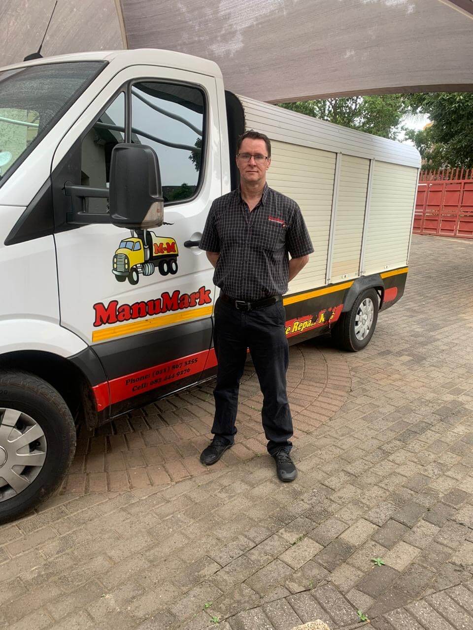 ManuMark team member with a commercial truck